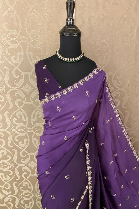 Violet soft organza silk saree with intricate embroidery, paired with an unstiched blouse, ideal for party wear by Saarang Sarees.