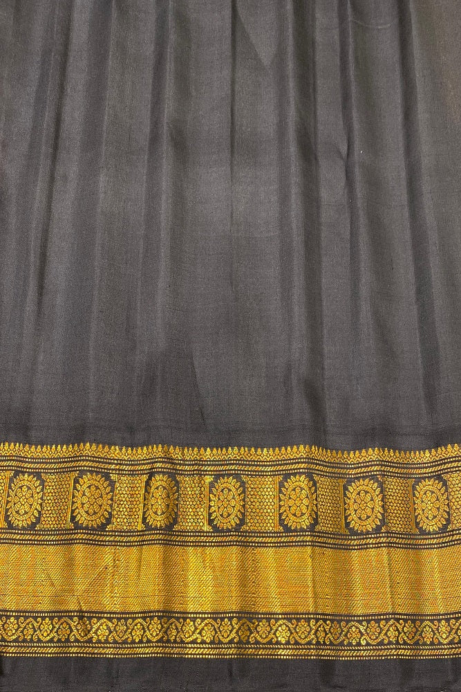 Yellow Gadwal silk saree with traditional design and unstiched blouse from Saarang Sarees, showcasing intricate patterns and rich texture.