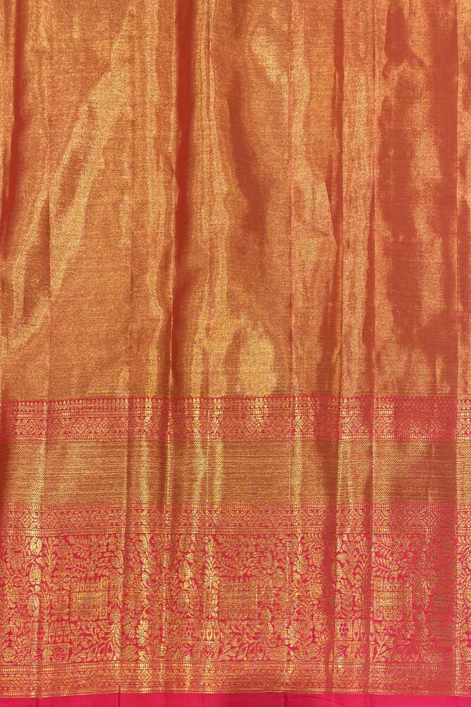 Golden Kanjeevaram silk saree by Saarang Sarees with intricate traditional patterns and an unstiched blouse for elegant festive wear.