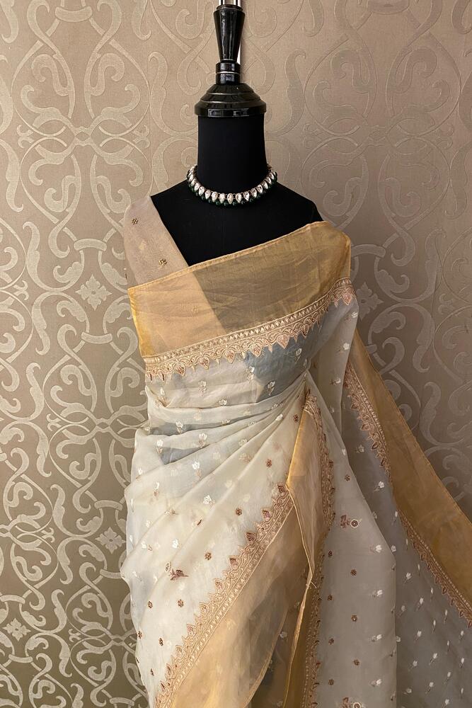 Off-White organza silk saree with intricate embroidery and unstitch blouse, ideal for party wear, by Saarang Sarees.