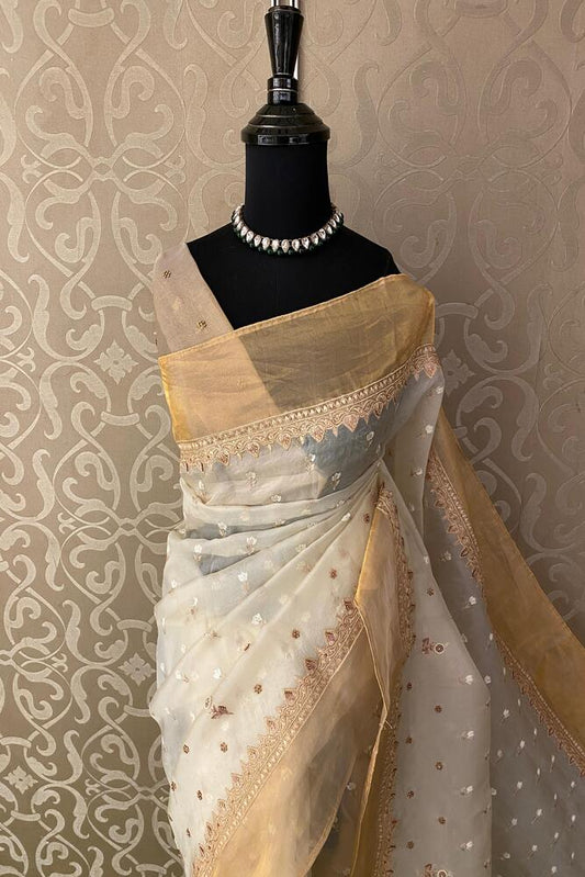 Off-White organza silk saree with intricate embroidery and unstitch blouse, ideal for party wear, by Saarang Sarees.