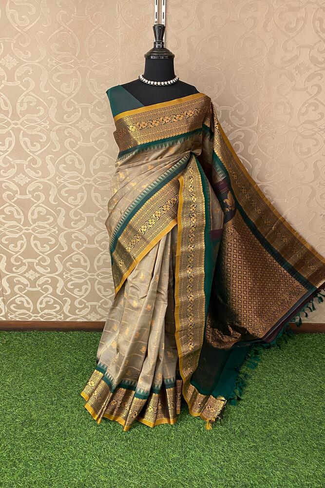 Grey Gadwal silk saree with traditional border and matching unstitched blouse, crafted by Saarang Sarees for elegant Indian wear.