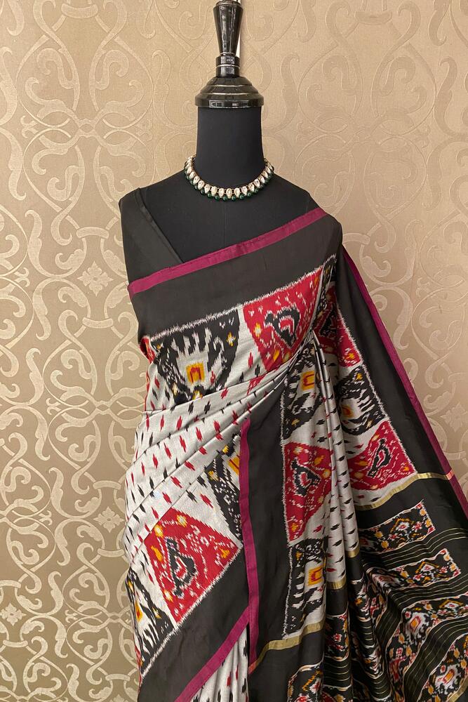 Multi Pochampally Ikat silk saree with traditional design and vibrant colors, paired with an unstiched blouse, from Saarang Sarees.