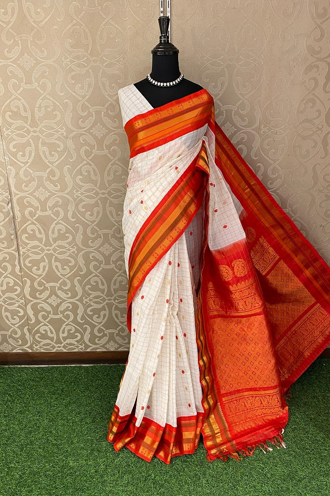 Off-White Sico Gadwal saree from Saarang Sarees with an unstitched blouse, traditional Indian attire in vibrant woven fabric.