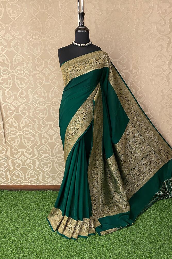Deep green Mysore crepe silk Banarasi saree with intricate gold zari work and matching unstiched blouse, traditional wear by Saarang Sarees.