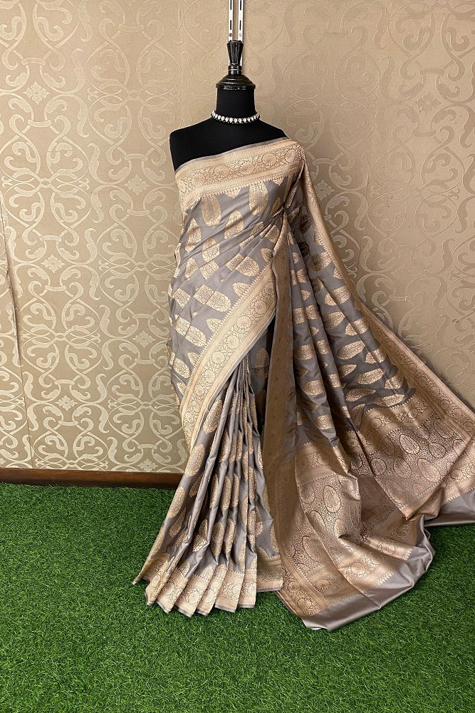 Grey Uppada Banarasi saree with intricate gold zari work and matching unstiched blouse, traditional Indian women’s wear.