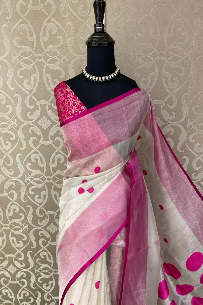 White and purple tissue Banarasi silk saree with intricate patterns and an unstiched blouse, traditional wear by Saarang Sarees.