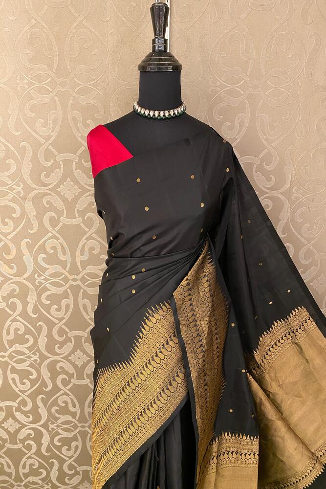 Black Coimbatore silk saree by Saarang Sarees with an unstiched blouse, traditional Indian wear with intricate silk detailing.
