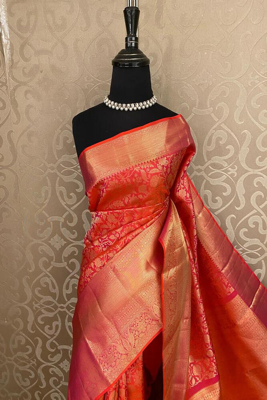 Red Pure Kanjeevaram silk saree with intricate gold zari work and unstiched blouse, traditional Indian wear by Saarang Sarees.