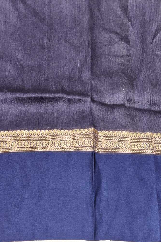 Navy blue Tussar Banarasi silk saree with hand-woven motifs and unstiched blouse, traditional wear by Saarang Sarees.