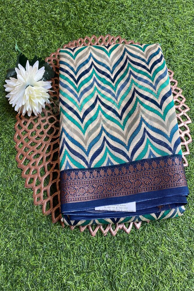 Blue cotton Chanderi saree with traditional design and unstiched blouse from Saarang Sarees, showcasing intricate fabric details.