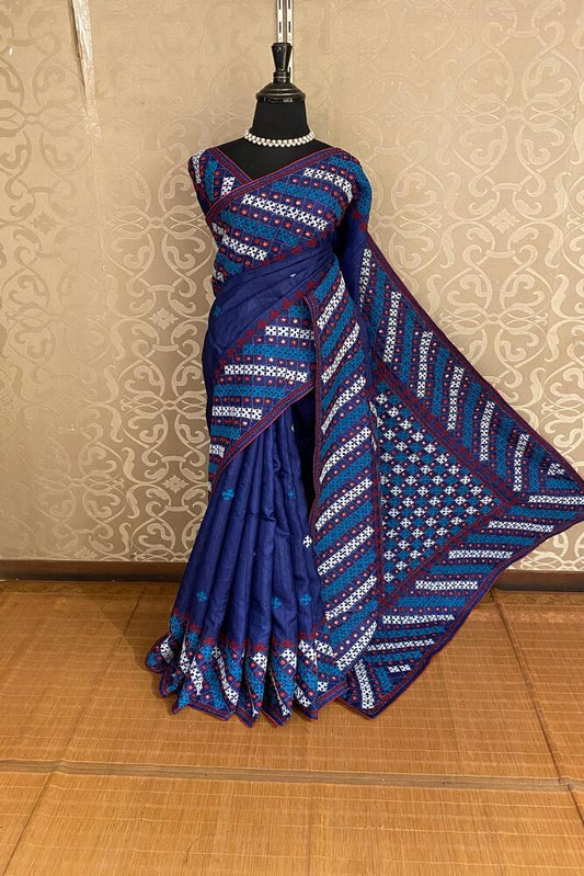 Deep blue Tussar Lambani and Kutch work saree with stitched blouse, traditional wear by Saarang Sarees, showcasing intricate embroidery.