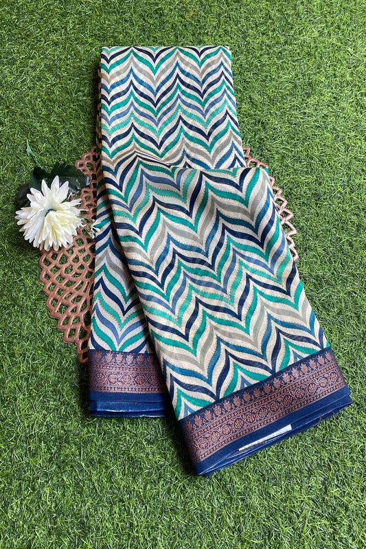 Blue cotton Chanderi saree with traditional design and unstiched blouse from Saarang Sarees, showcasing intricate fabric details.