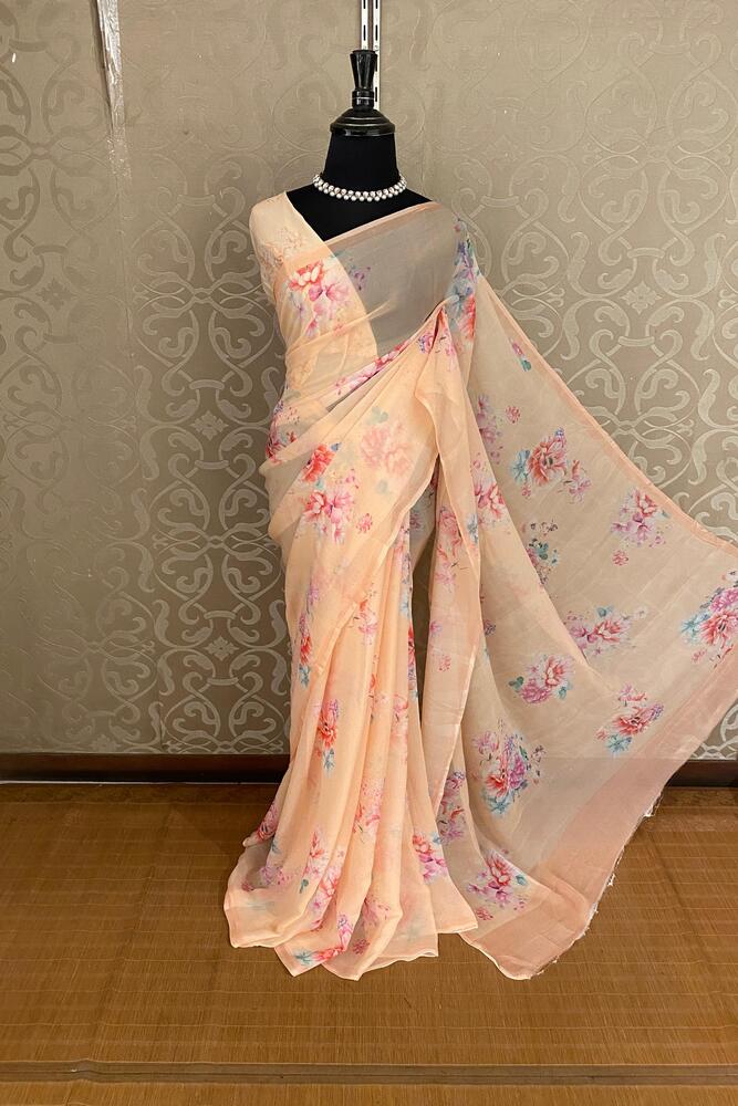 Peach floral printed chiffon saree with unstiched blouse piece, perfect for party wear by Saarang Sarees.
