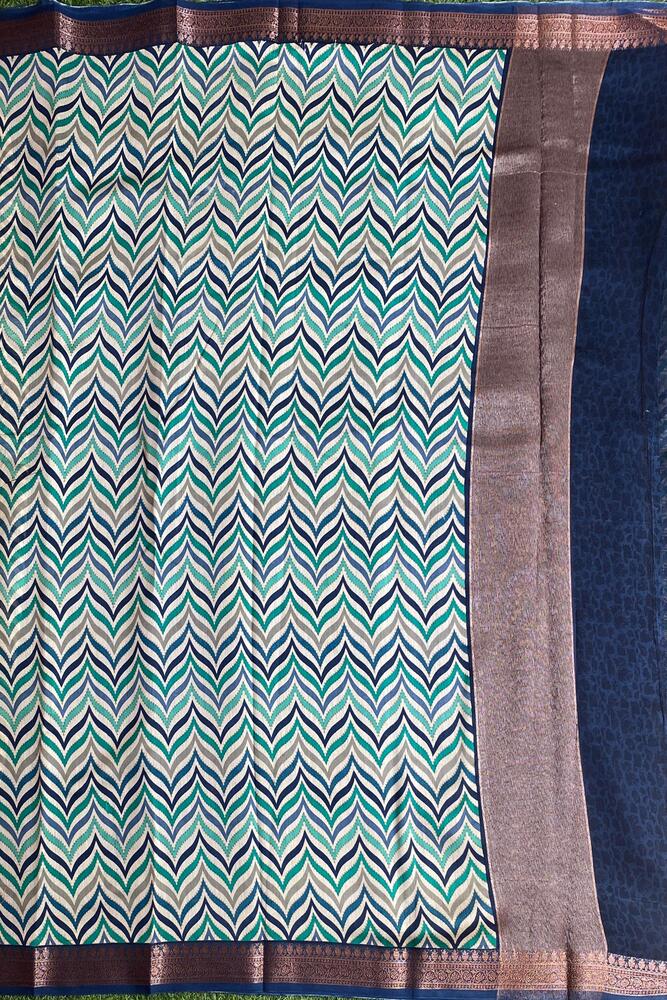 Blue cotton Chanderi saree with intricate traditional patterns from Saarang Sarees, paired with an unstiched blouse for elegant wear.