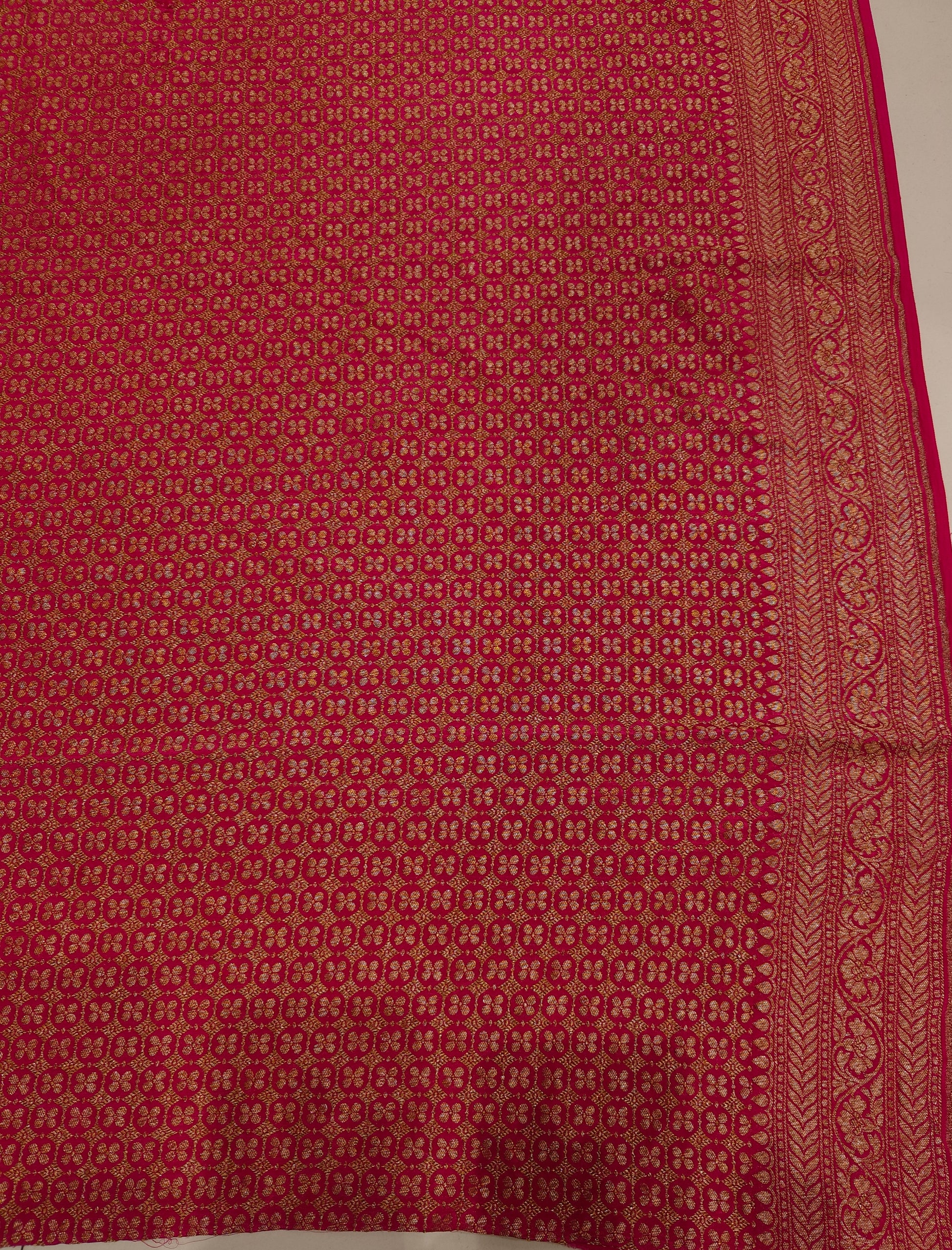 Rani crepe Khaddi Banarasi silk saree with intricate gold zari work and matching unstiched blouse, traditional Indian attire by Saarang Sarees.