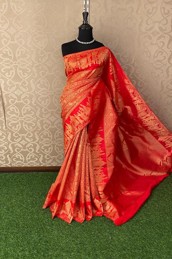 Red pure Kanjeevaram silk saree from Saarang Sarees with intricate gold zari work and matching unstiched blouse fabric.