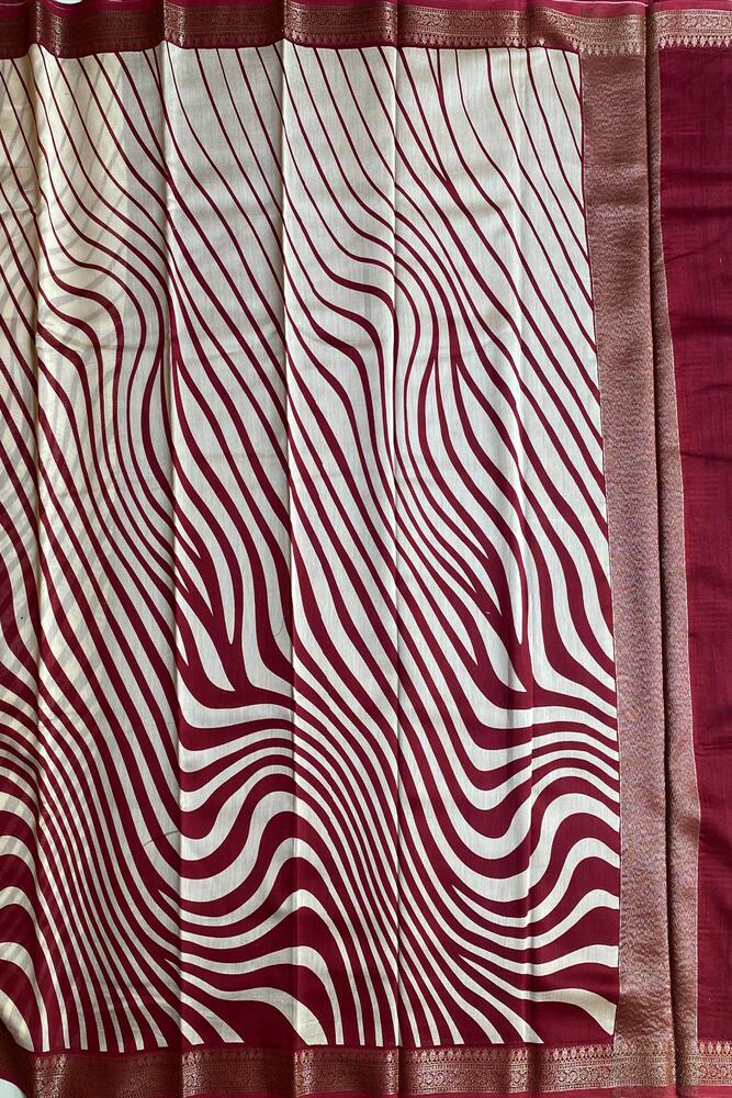 Red and white cotton Chanderi saree with traditional design and unstiched blouse, showcased by Saarang Sarees.