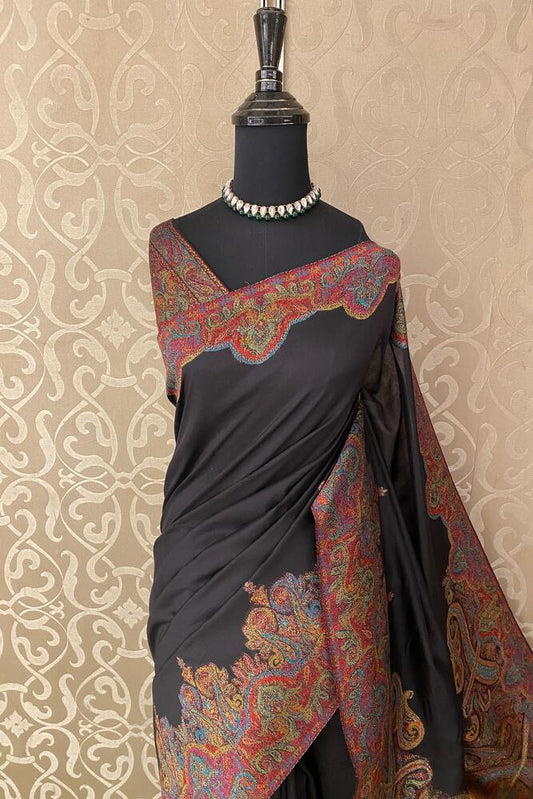 Black pure Kani handloom silk saree with woven jamewar blouse, traditional wear from Saarang Sarees, shown with intricate weaving details.