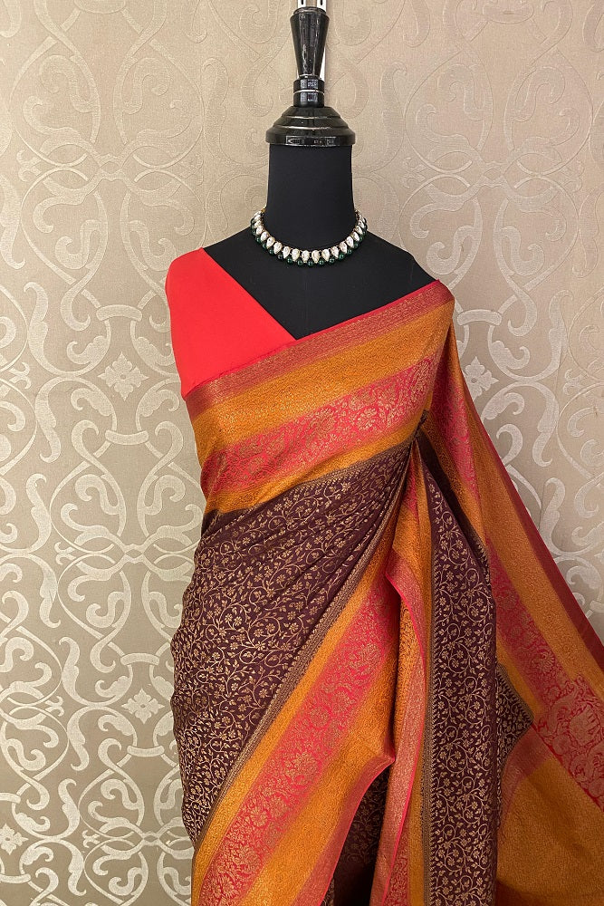 Brown Mysore crepe saree with brocade pattern for party wear, paired with an unstiched blouse from Saarang Sarees.