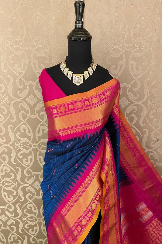 Indigo blue Gadwal silk saree from Saarang Sarees with intricate traditional design and matching unstiched blouse, elegant for special occasions.