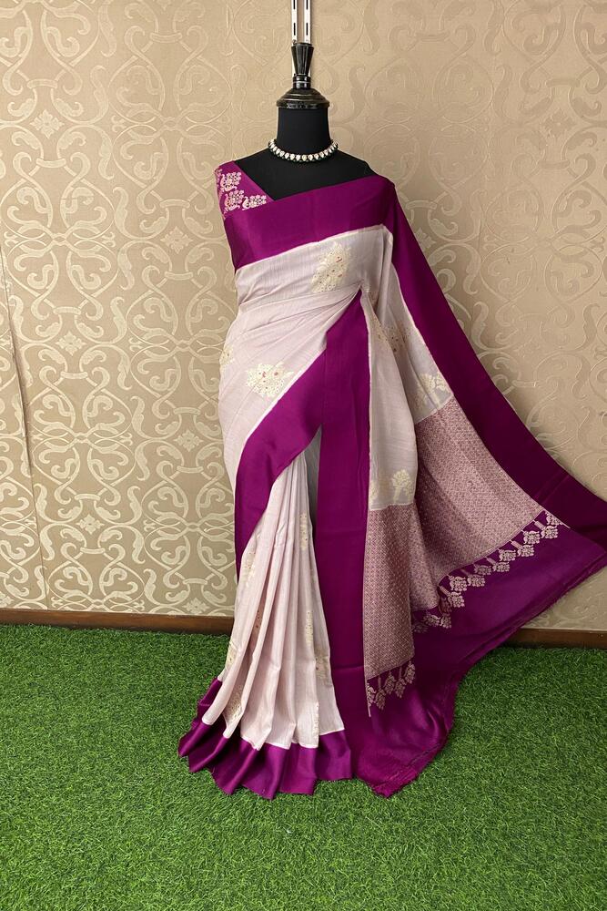 Lavender and purple Munga Banarasi silk saree with intricate gold zari work, paired with an unstitched blouse, traditional wear from Saarang Sarees.