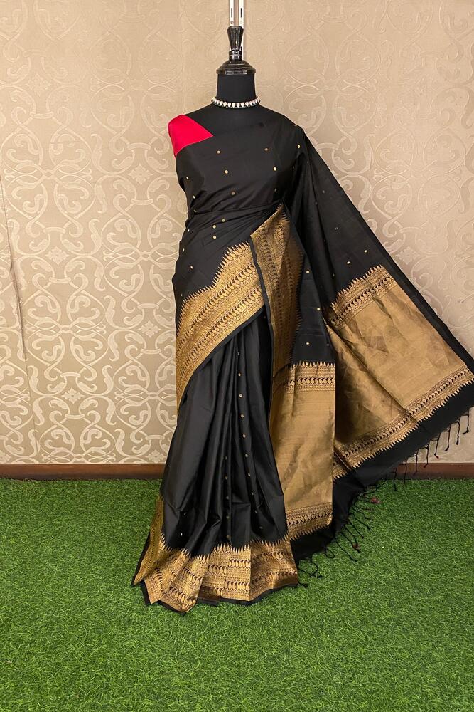 Black Coimbatore silk saree with intricate zari work, paired with an unstiched blouse, traditional Indian wear by Saarang Sarees.