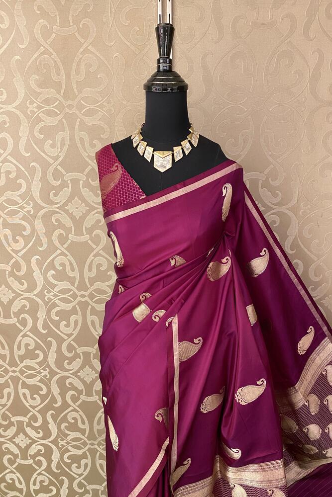 Deep purple Katan Mashru Silk Banarasi saree by Saarang Sarees with intricate gold motifs and matching unstiched blouse for traditional wear.