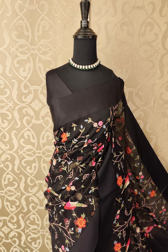 Black organza silk saree with cross-stitch work and unstiched blouse, elegant party wear Saarang Sarees traditional attire.