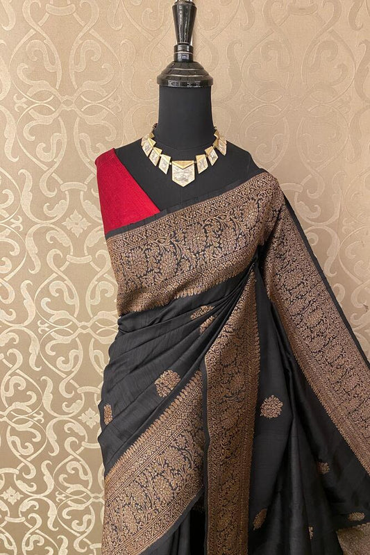Black Pure Raw Tussar Banarasi silk saree with hand-woven motifs and matching unstitched blouse from Saarang Sarees.