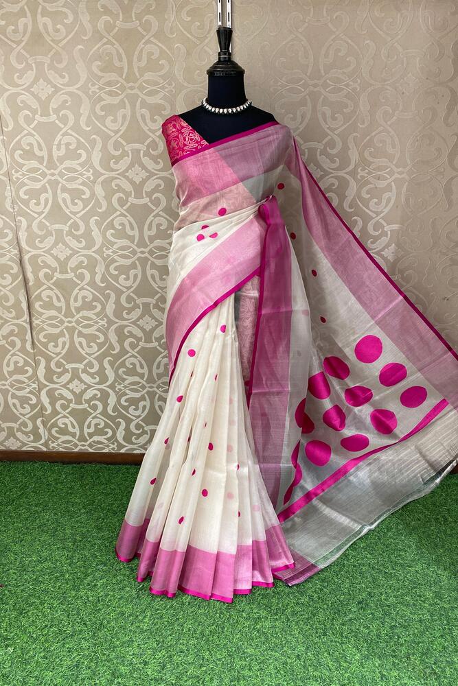 White and purple tissue Banarasi silk saree with intricate designs, paired with an unstiched blouse, traditional wear by Saarang Sarees.