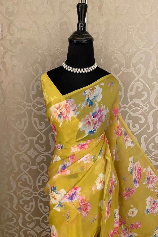 Mustard yellow floral printed chiffon saree with unstiched blouse piece, designed for party wear by Saarang Sarees.