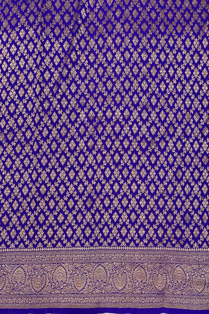 Purple Mysore Crepe Silk Banarasi Saree with intricate gold zari work and matching unstiched blouse, traditional wear from Saarang Sarees.