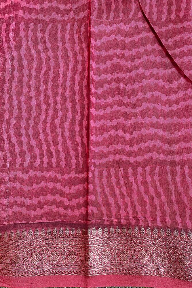 Maroon cotton Chanderi saree with intricate border and pallu, paired with an unstiched blouse, traditional wear by Saarang Sarees.