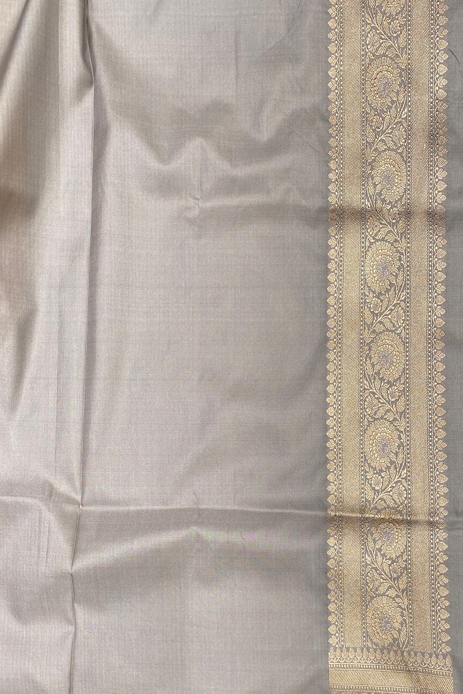 Grey Uppada Banarasi saree with intricate gold zari work and unstiched blouse, traditional Indian wear by Saarang Sarees.