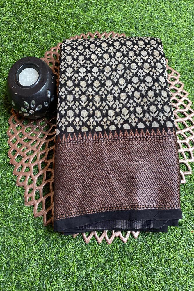 Black and white cotton Chanderi saree with unstiched blouse from Saarang Sarees, featuring traditional woven pattern and elegant drape.