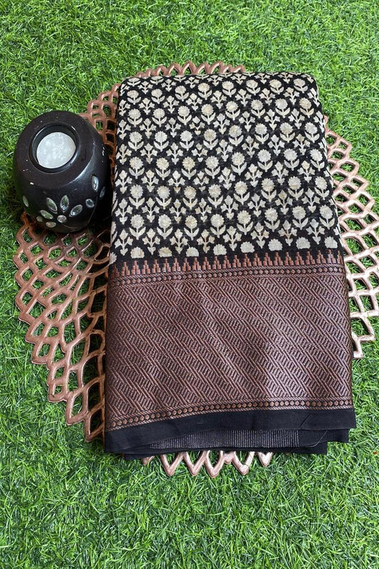 Black and white cotton Chanderi saree with unstiched blouse from Saarang Sarees, featuring traditional woven pattern and elegant drape.