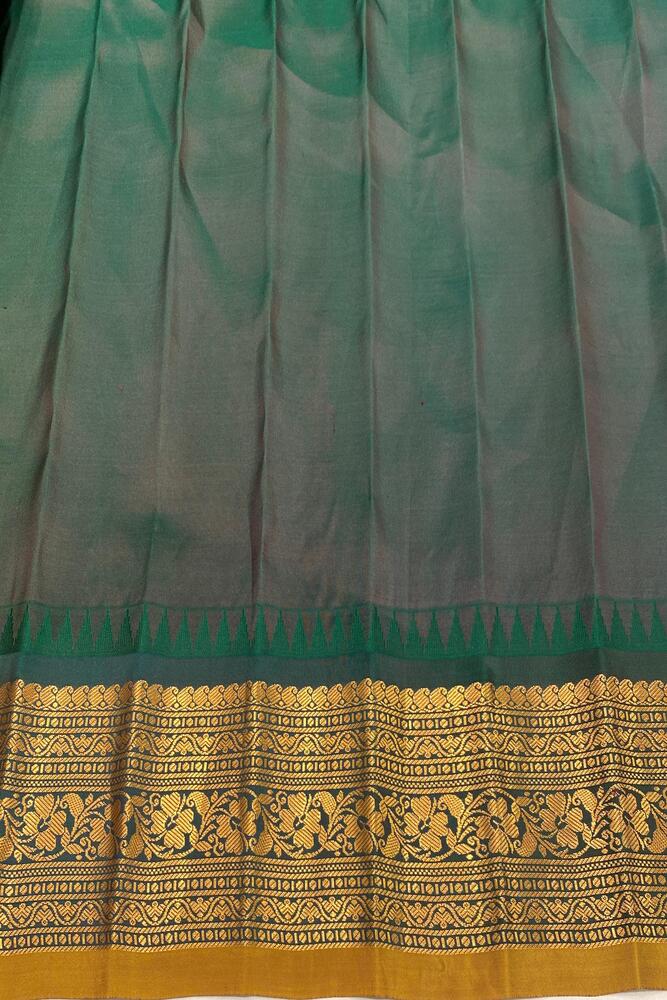 Grey Gadwal silk saree with traditional design and matching unstiched blouse from Saarang Sarees, displayed on a hanger.