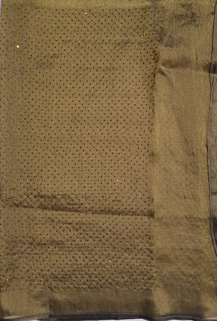 Green tissue crepe silk saree with stone work and unstiched blouse, perfect for party wear by Saarang Sarees.