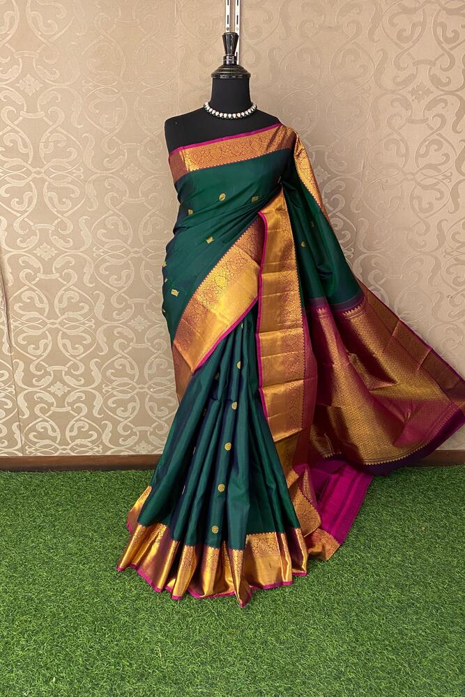 Bottle green pure Kanjeevaram silk saree with traditional design and unstiched blouse, showcased by Saarang Sarees.