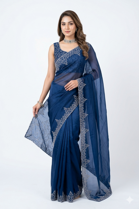 Navy blue soft organza silk saree with intricate embroidery and unstiched blouse, perfect for party wear by Saarang Sarees.