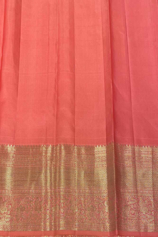 Peach pink Kanjeevaram silk saree by Saarang Sarees with traditional design and unstiched blouse, perfect for festive occasions.