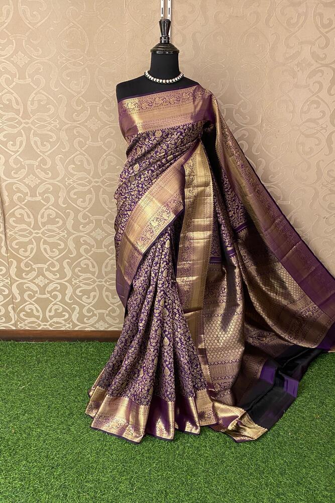 Deep violet pure Kanjeevaram silk saree with gold zari work and matching unstiched blouse, traditional wear by Saarang Sarees.