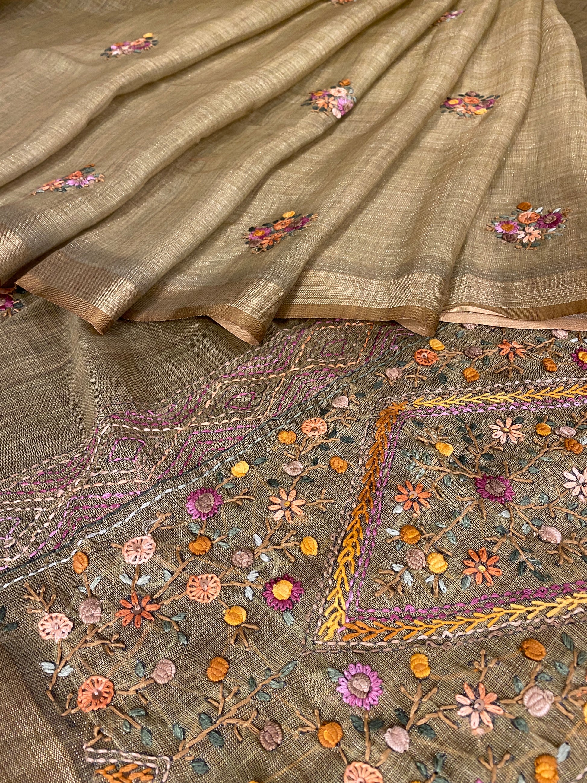 Pista green linen saree with bullion stitch work and unstiched blouse from Saarang Sarees, traditional wear displayed on a mannequin.