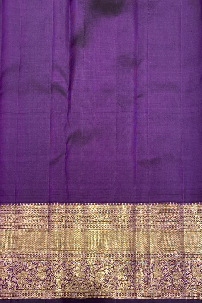 Deep violet pure Kanjeevaram silk saree with traditional gold zari work and matching unstiched blouse, crafted by Saarang Sarees.