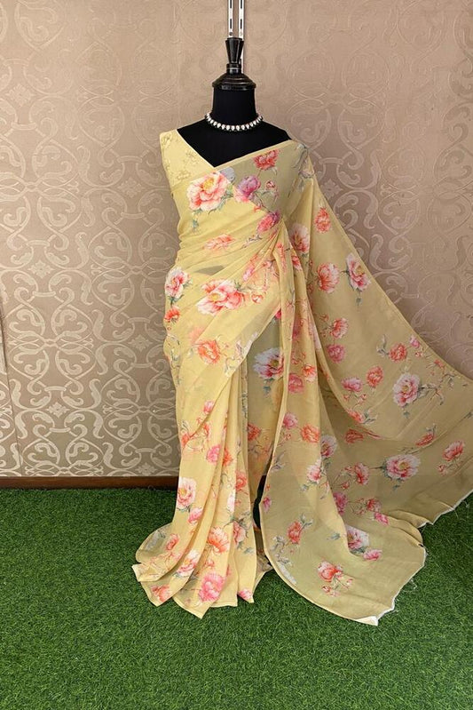 Yellow floral printed chiffon saree with matching unstitched blouse piece, designed for party wear by Saarang Sarees.
