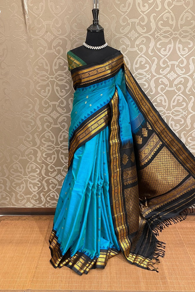 Blue Sico Gadwal saree with intricate traditional patterns and matching unstiched blouse from Saarang Sarees.