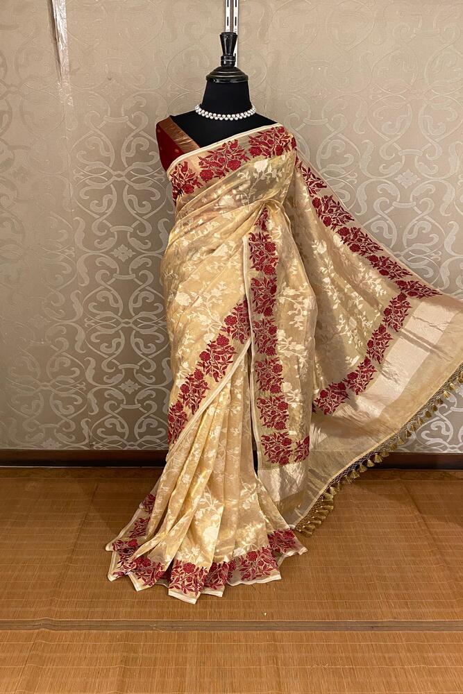 Beige tissue Banarasi silk saree with Resham embroidery border and unstiched blouse, stylish party wear by Saarang Sarees.