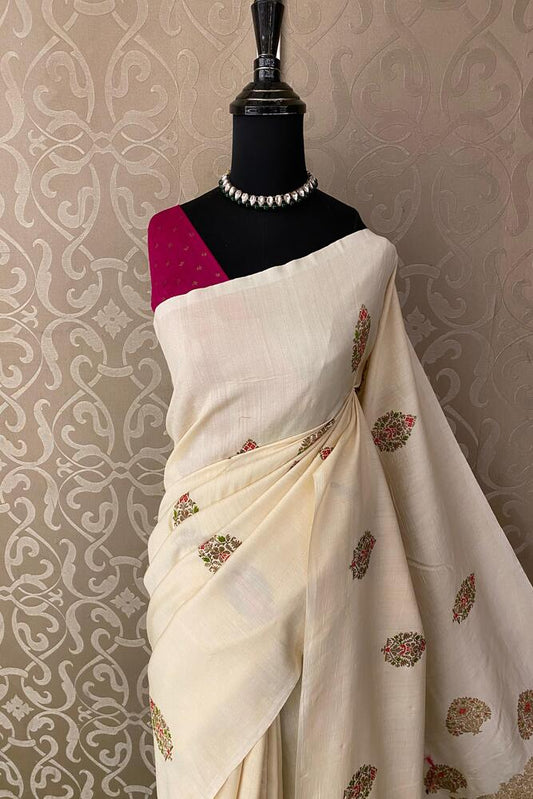 Off-White Munga Banarasi silk saree with intricate gold zari work and matching unstiched blouse, traditional Indian wear by Saarang Sarees