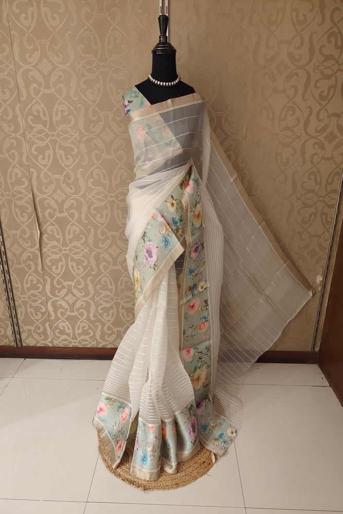 Off-White Organza Resham printed party wear saree with matching unstiched blouse from Saarang Sarees, showcasing intricate embroidery and design.